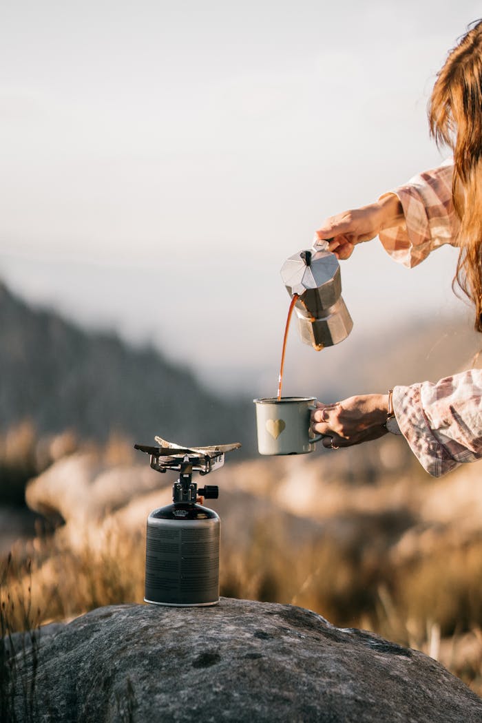 Pouring Brewed Coffee into a Mug